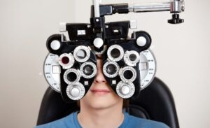 Checking a child's vision during myopia management exam