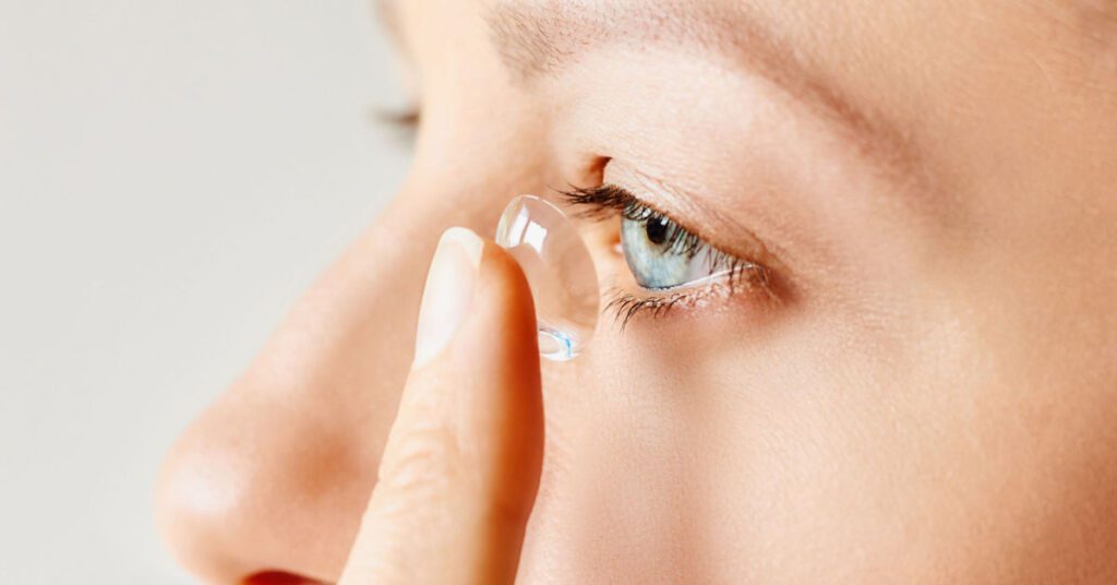 Michigan Contact Lens | Scleral Lenses for Troy Residents with Corneal Irregularities A patient carefully inserting a custom lens, demonstrating the process for getting Scleral Lenses in Troy MI