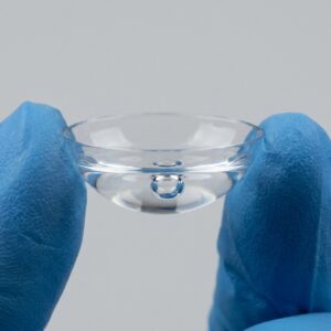 Scleral lens filled with saline showing a trapped air bubble