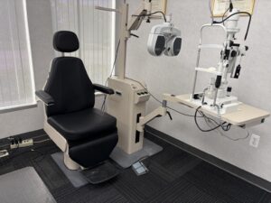 Comprehensive eye exam lane with phoropter and slit lamp at Michigan Contact Lens in Southfield, MI
