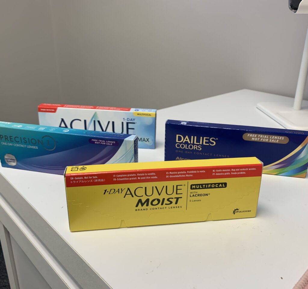 A selection of different contact lens boxes available after a contact lens exam in Detroit.